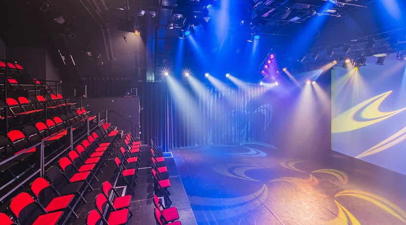 Theater in Melkweg with tiered seating, ideal for performances and events.