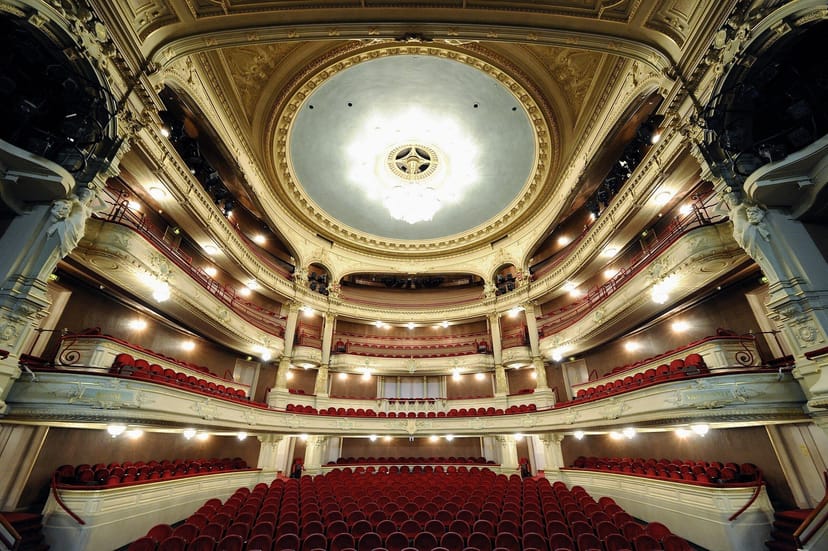 Ajaxfoyer, ornate ceiling theater venue for elegant events and performances.
