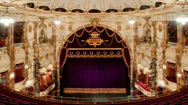 Trafalgar Room at London Coliseum with ornate arch, ideal for galas and award ceremonies.