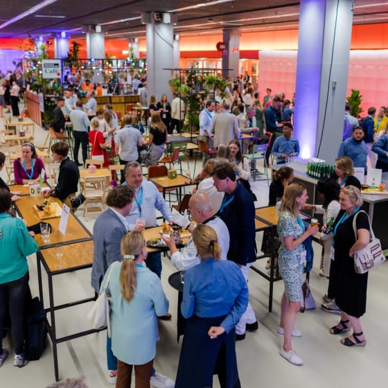 Vibrant networking event in Beatrix Theatre's Expo Room with informal seating and bar.