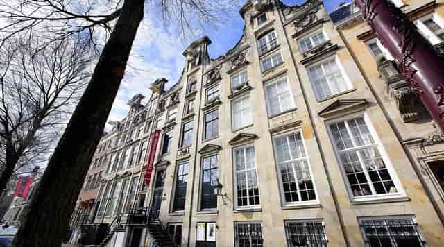 Historic Cromhout House exhibition with large windows for exclusive events.