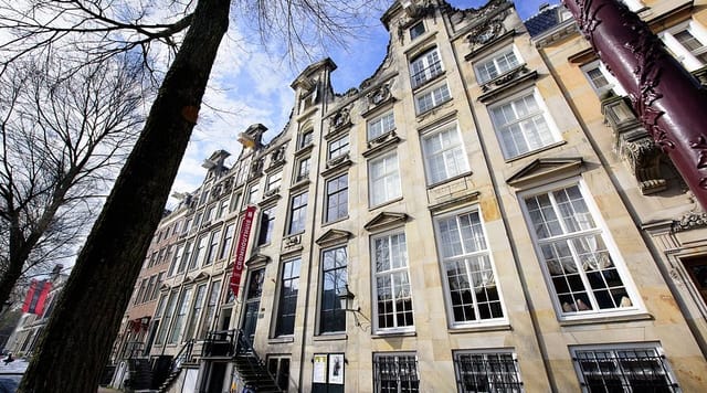 Historic Cromhout House exhibition with large windows for exclusive events.