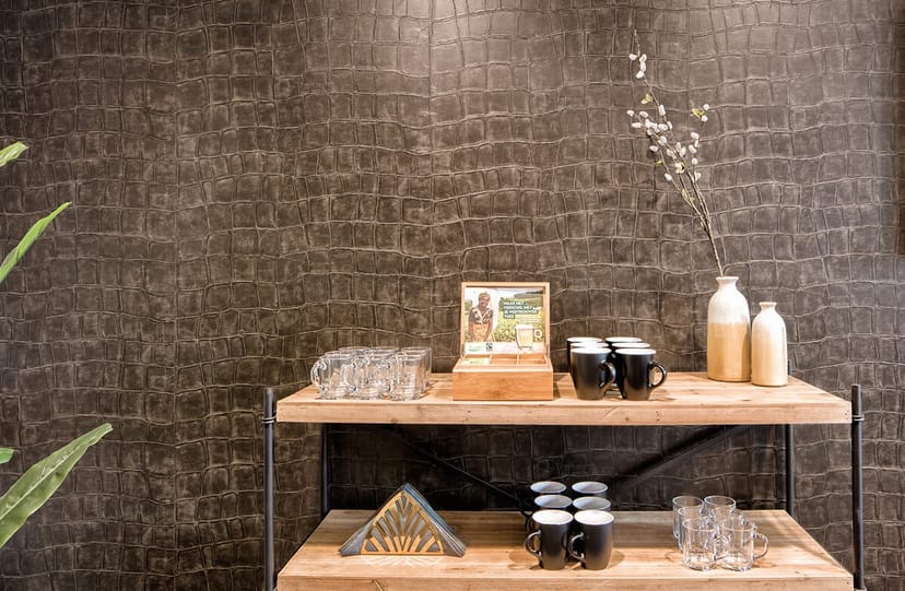 Refreshment area in StudioZoost with wooden shelves, ideal for meetings and events.