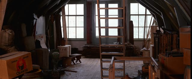 Secret Annex in Anne Frank House: rustic attic with beams, ideal for intimate events.