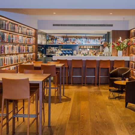 Stylish restaurant bar area, inviting atmosphere for networking events or meetings.