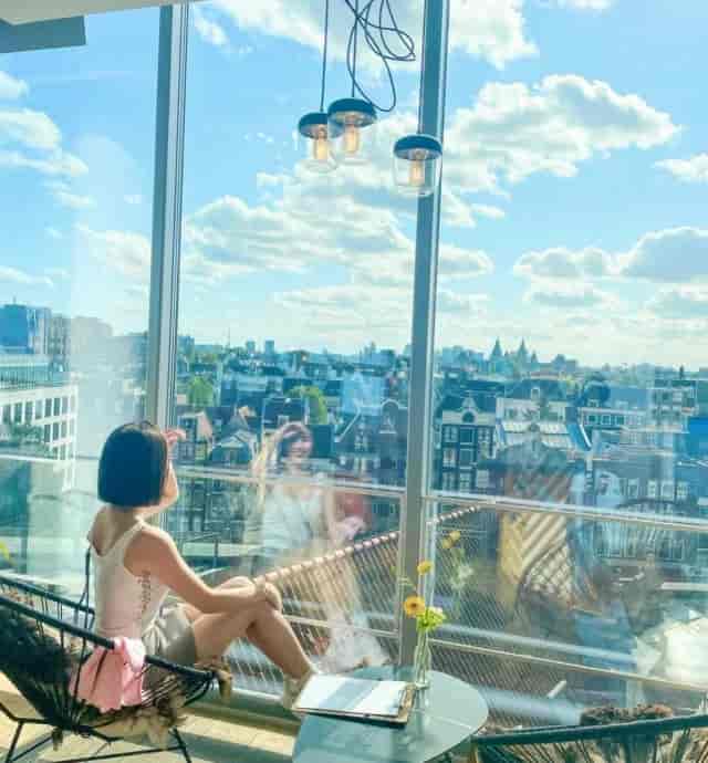 Serene meeting venue in Blue Amsterdam with natural light and urban views.