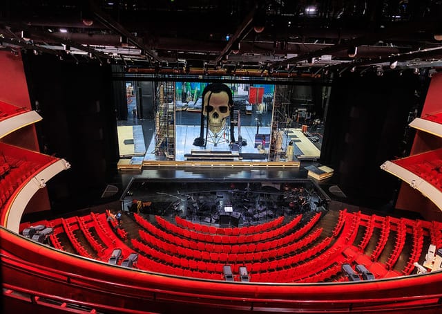 Auditorium at Dutch National Opera & Ballet with red seating for vibrant events.