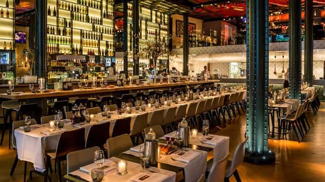Elegant restaurant venue Café de Kroon with candlelit tables for events and meetings.