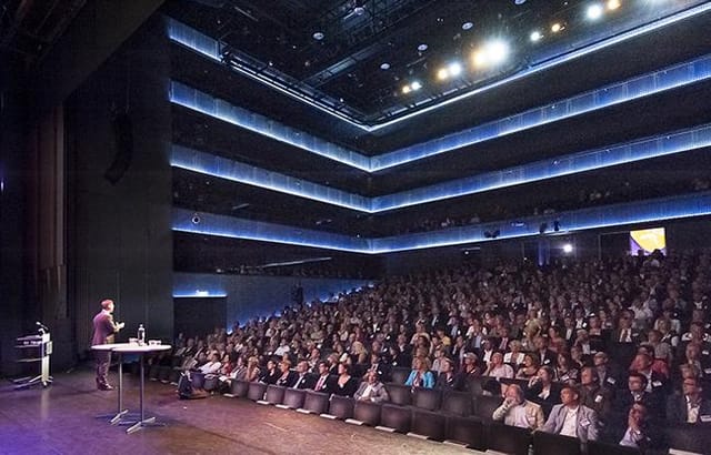 Kleine Zaal auditorium with tiered seating, perfect for conferences and corporate events.