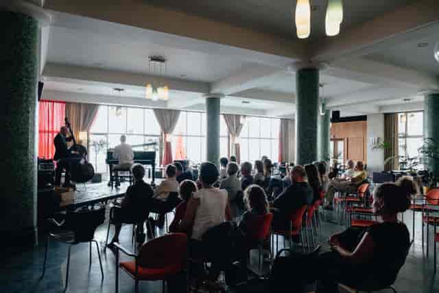 Centrale Hal event with seated audience, vibrant atmosphere for networking and entertainment.