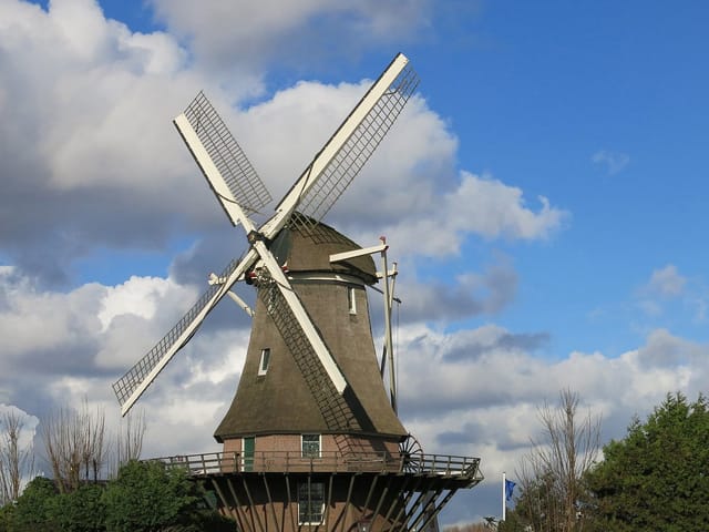 Traditional windmill at Molen van Sloten, ideal for outdoor events and cultural experiences.