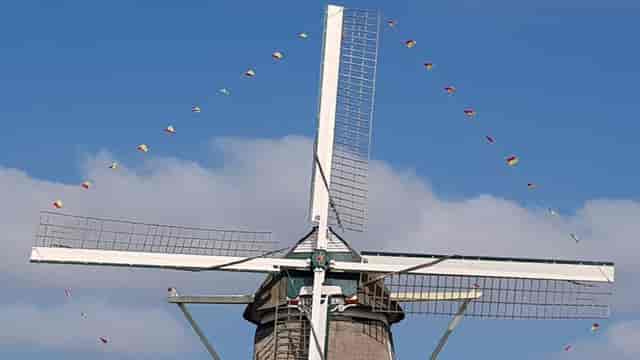 Classic windmill at Molen van Sloten, perfect for rustic weddings and outdoor events.