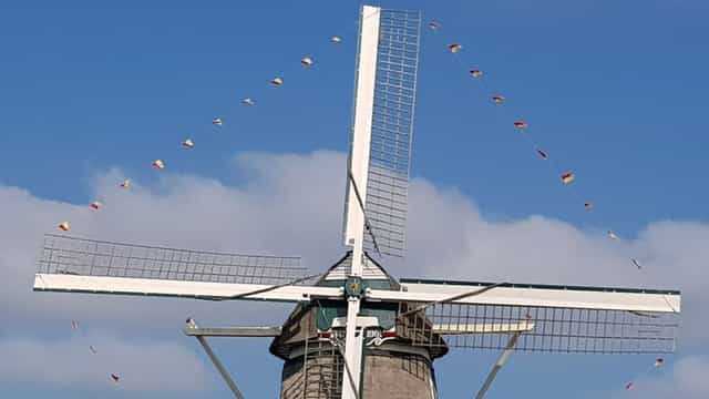 Classic windmill at Molen van Sloten, perfect for rustic weddings and outdoor events.