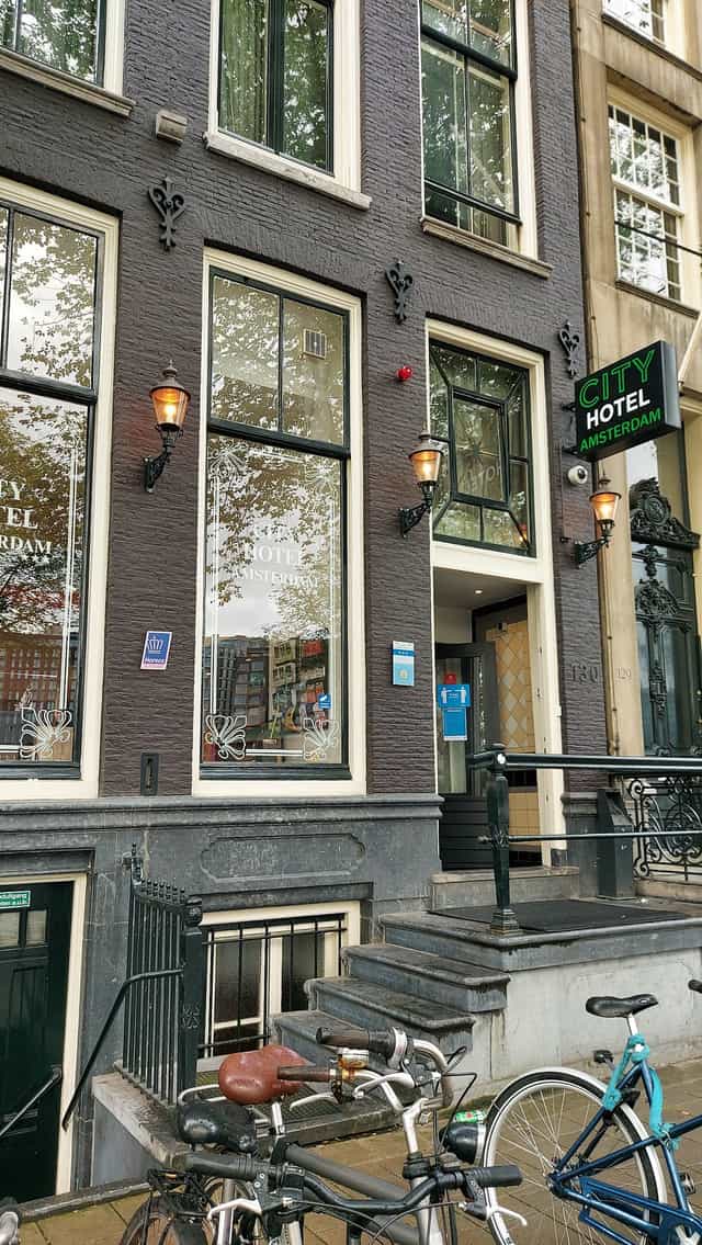 Elegant Amsterdam hotel lounge exterior with inviting lighting for events.