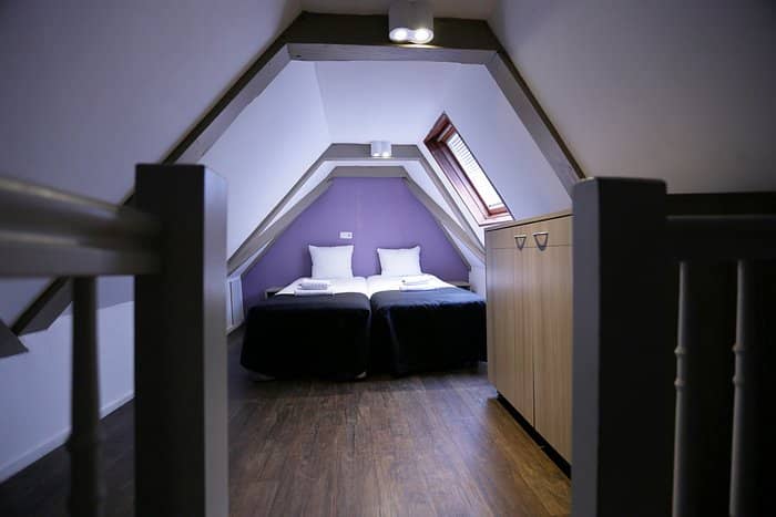 Cozy attic lounge in City Hotel for retreats and team-building events.