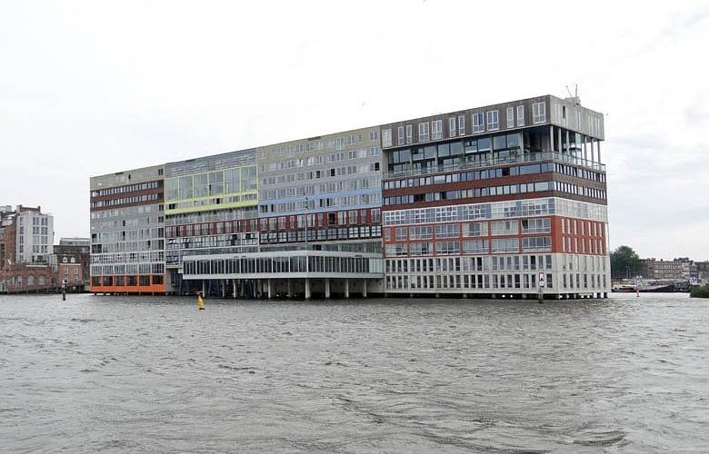 "Siloterras building on water, modern venue for corporate events and gatherings."