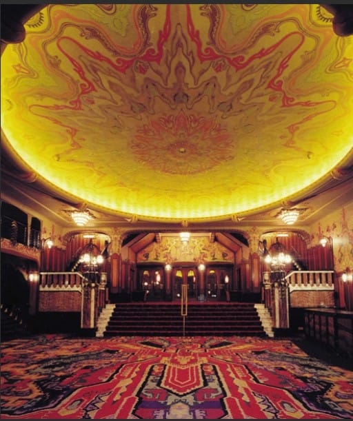 "Grand theater stage in Koninklijk Theater Tuschinski, perfect for upscale events and performances."