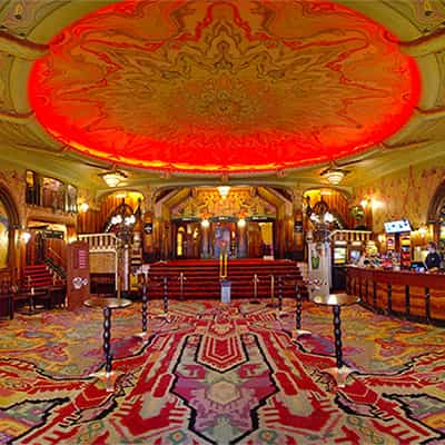 Foyer of Koninklijk Theater Tuschinski, elegant venue for meetings and receptions.