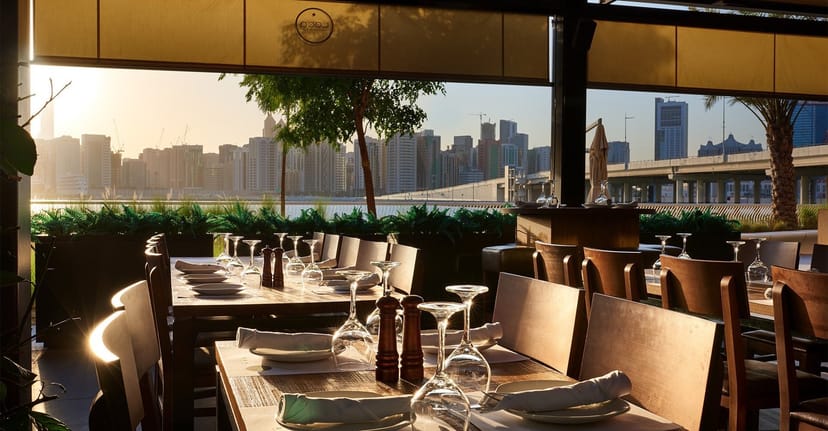 Elegant dining area in The Galleria with city skyline, ideal for upscale events.