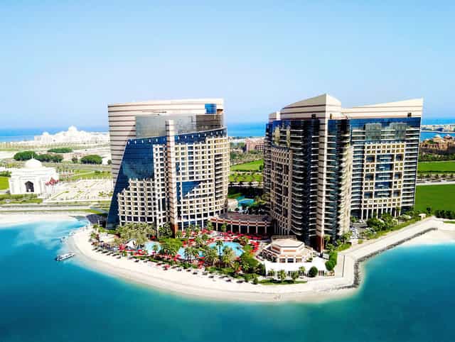 Luxurious poolside gardens at Khalidiya Palace Rayhaan for events and conferences.