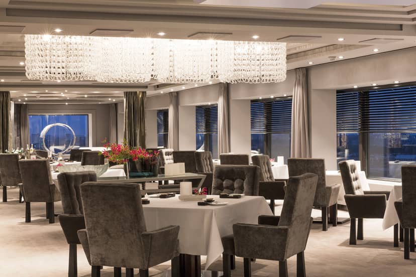 Elegant Ciel Bleu Restaurant dining space with chandelier, perfect for upscale events.