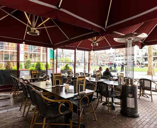 Charming outdoor dining terrace in Royal Amsterdam, ideal for events and gatherings.