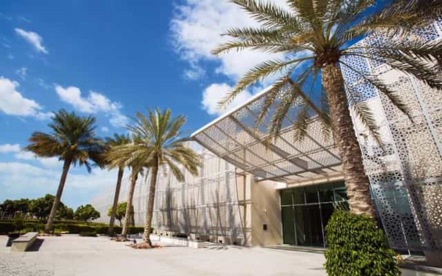Modern venue with glass facade at Manarat Al Saadiyat, ideal for events and gatherings.