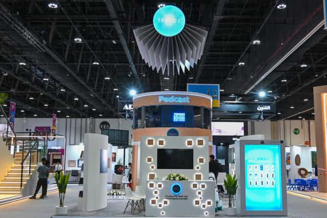 Conference Hall A at Abu Dhabi Book Fair 2024 with vibrant booth design for networking.