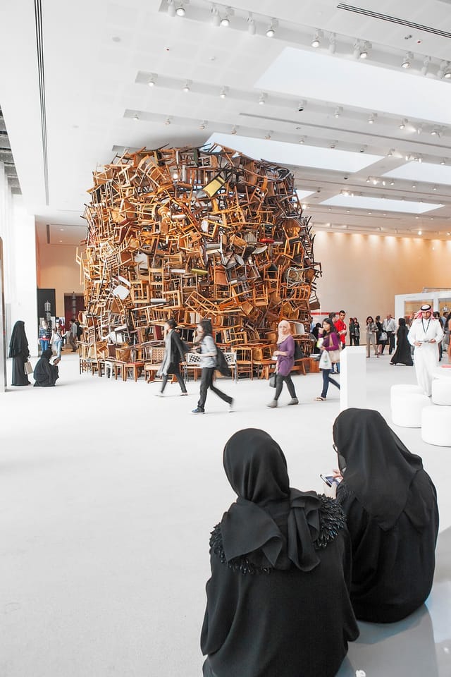 Striking chair installation at Abu Dhabi Art workshops for networking and creativity.