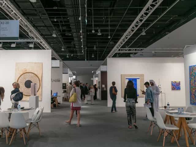 Vibrant Abu Dhabi Art exhibition with spacious layout for networking and collaboration.
