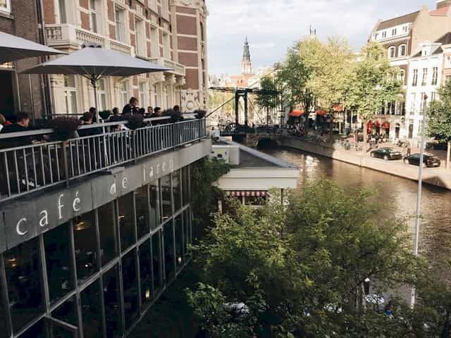 Balcony at Café de Jaren, ideal for networking events by the canal.