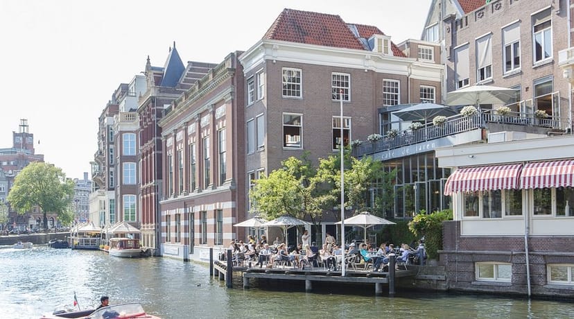Café de Jaren canal-side venue with outdoor seating, perfect for summer events and receptions.