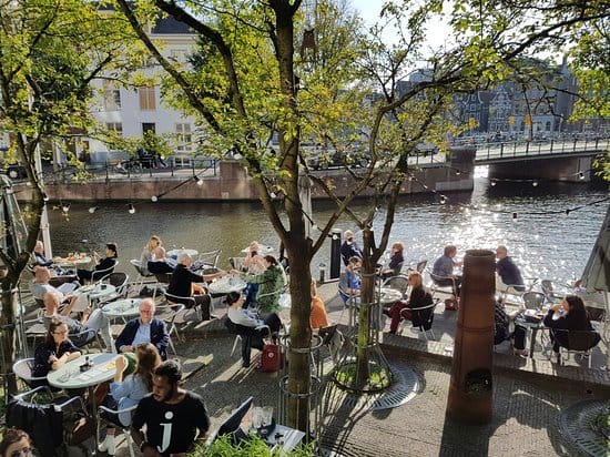 Lively Café de Jaren waterfront venue, perfect for casual gatherings and networking events.