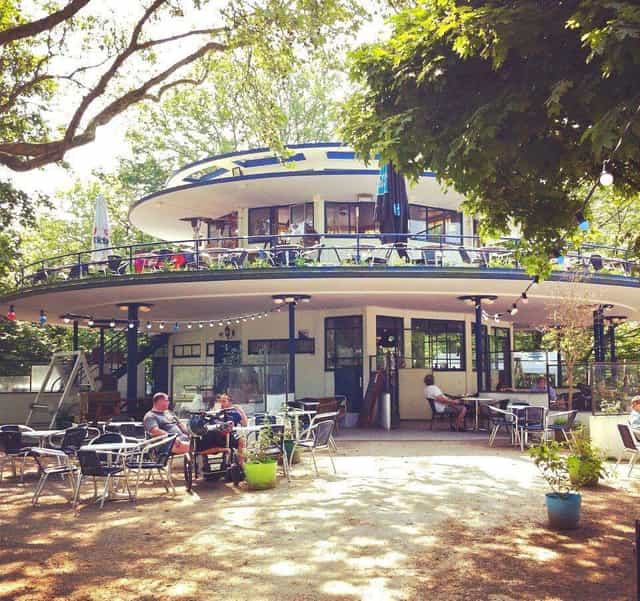 Modern circular restaurant with outdoor seating for dynamic meetings and creative events.