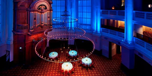 Elegant meeting room with blue lighting, perfect for gala dinners and corporate events.