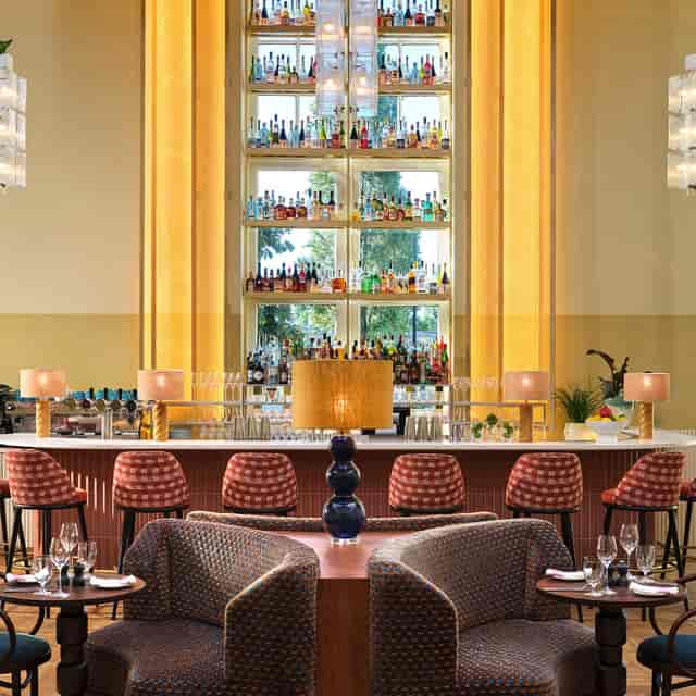 Stylish bar at The Hoxton, Amsterdam, ideal for networking events and cocktail receptions.