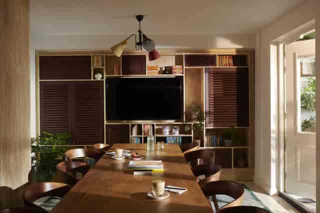 Library meeting space in The Hoxton, Amsterdam with warm wood tones for collaboration.