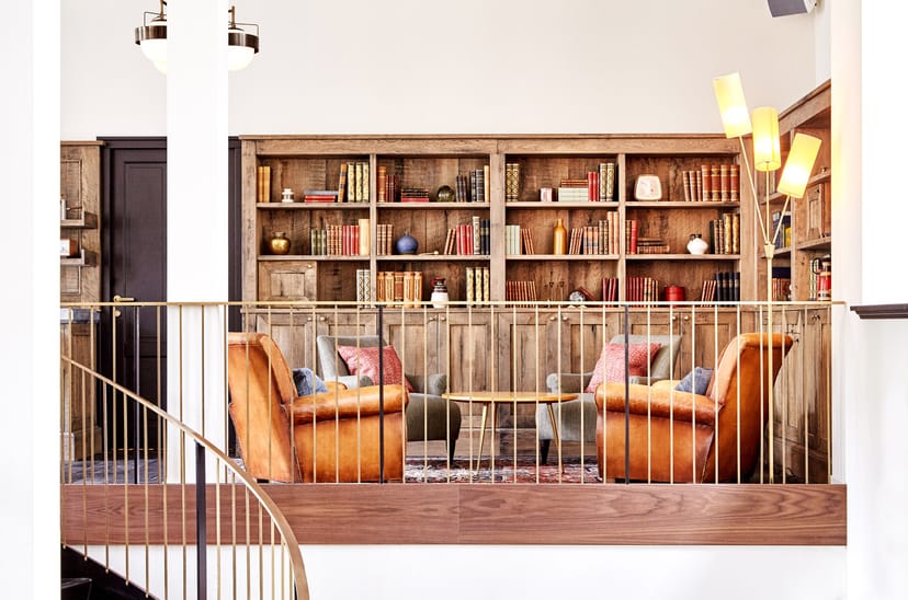 Stylish meeting space in The Hoxton, Amsterdam with cozy armchairs for networking events.