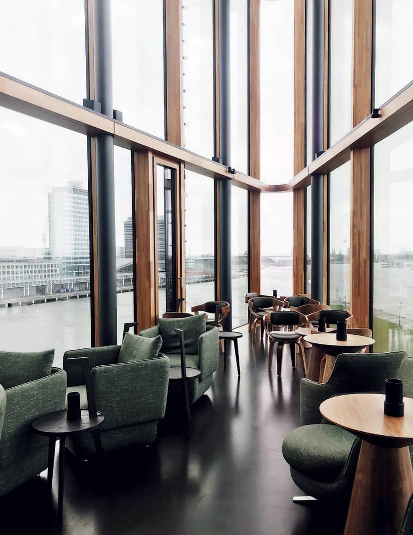 Modern event space at Hotel Jakarta Amsterdam with scenic water views, ideal for networking.