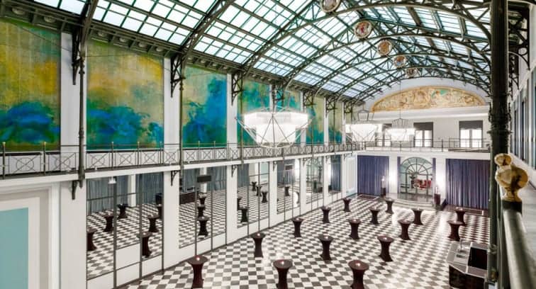 Elegant Wintergarden venue with high ceilings, perfect for upscale events and gatherings.