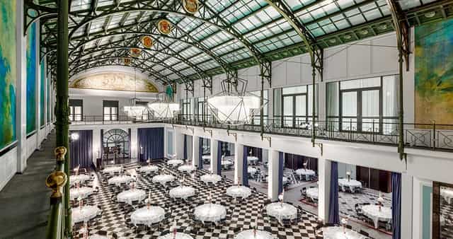 Elegant Wintergarden event space with high ceilings for weddings and corporate gatherings.