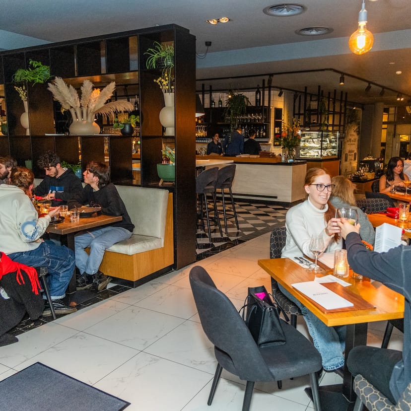 Cozy restaurant bar in Hulscher's, perfect for intimate gatherings and networking events.