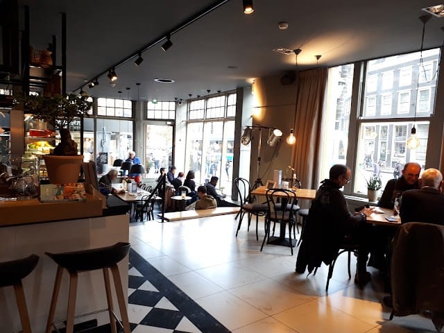 Modern café bar in Hulscher's with cozy seating for networking events and meetings.