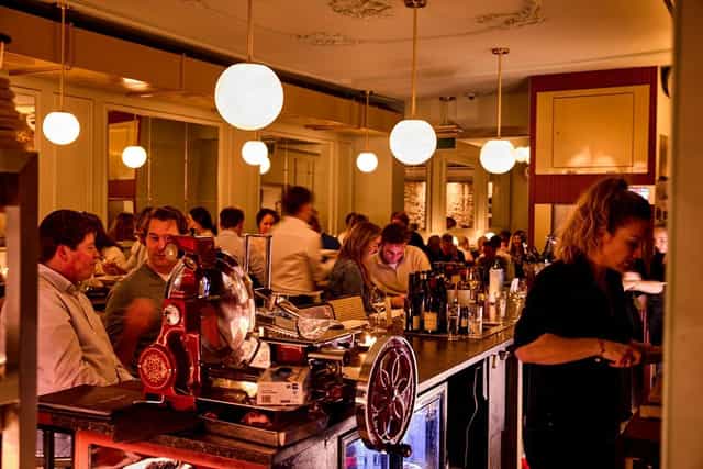 Bistrot Neuf Amsterdam bar scene perfect for networking and informal gatherings.