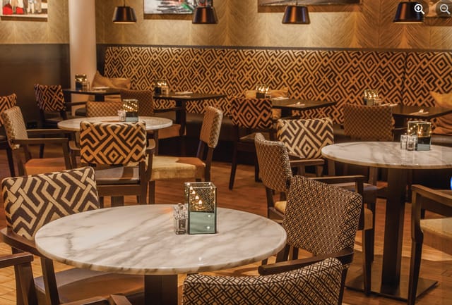 Private Hire Space at Eat Drink Meet with elegant dining and warm lighting for events.