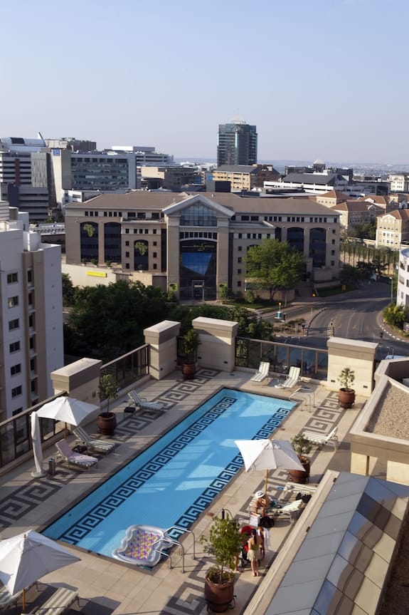 Stylish rooftop pool at Michelangelo Hotel, perfect for outdoor corporate events and networking.