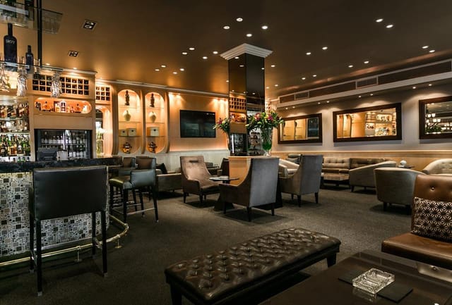 Sophisticated lounge at Signature Restaurant ideal for networking and cocktail events.