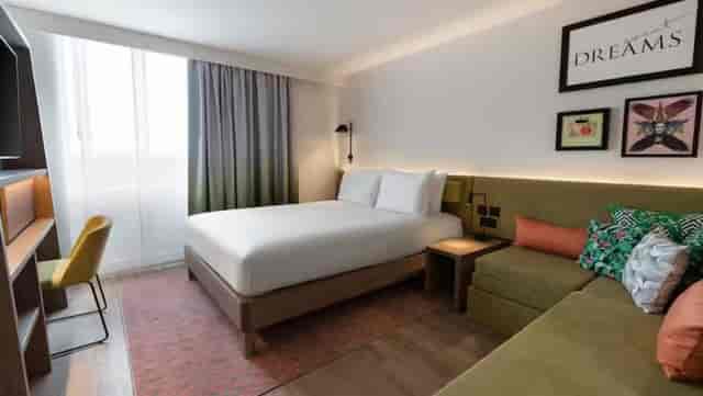 Modern hotel room at Hampton by Hilton Sandton, ideal for business travelers.