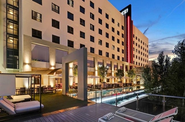 Modern hotel reception with outdoor pool, perfect for events in Cape Town.