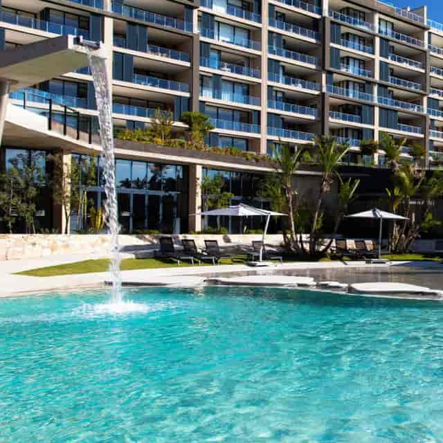 Luxurious event venue at The Houghton Hotel with serene poolside setting and elegant architecture.